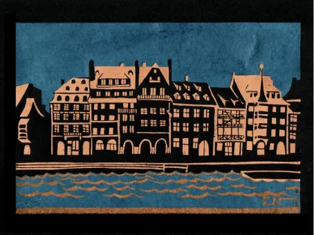 Linogravure du Quai des Bateliers à Strasbourg, impression en doré sur noir et papier découpés bleus